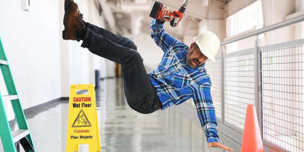 construction worker falling on a wet floor